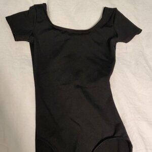 CAPEZIO KIDS dance bodysuit, size XS black + with MONDOR beige footless tights.
